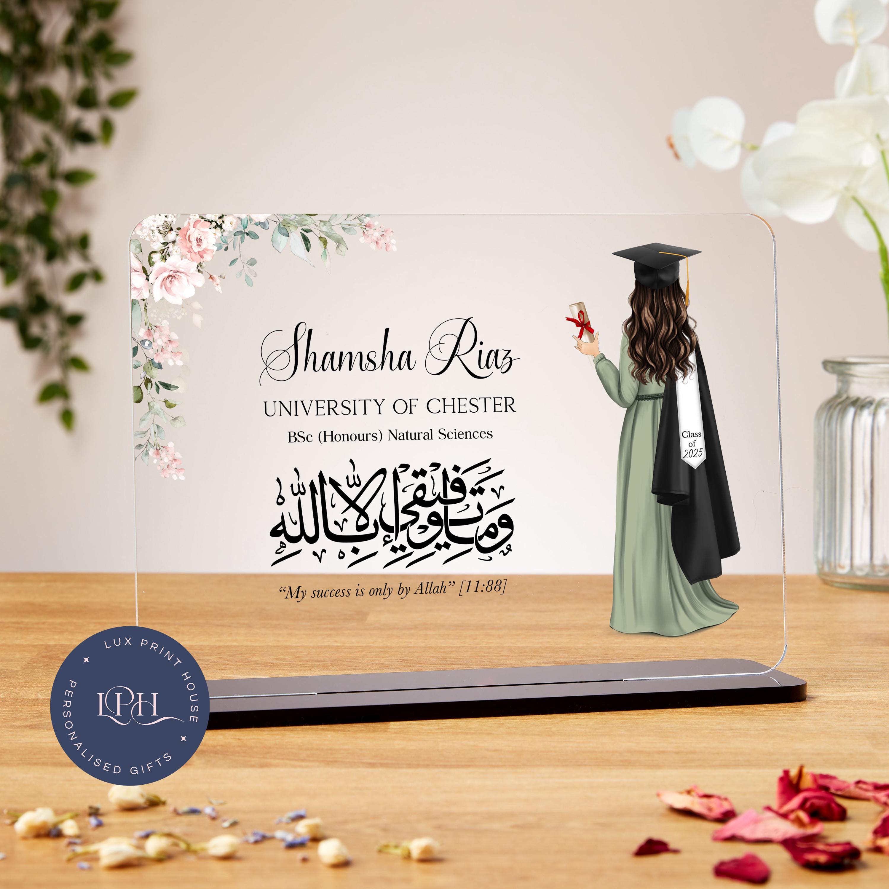 A floral-accented graduation plaque featuring an illustrated female graduate in a flowing dress, gown, and graduation cap, holding a diploma. Her stole reads “Class of 2025.” Arabic calligraphy is displayed with the English translation: “My success is only by Allah” [11:88]. The surrounding text is customisable for the graduate’s name, university, degree, and year, making it a thoughtful and spiritual gift.