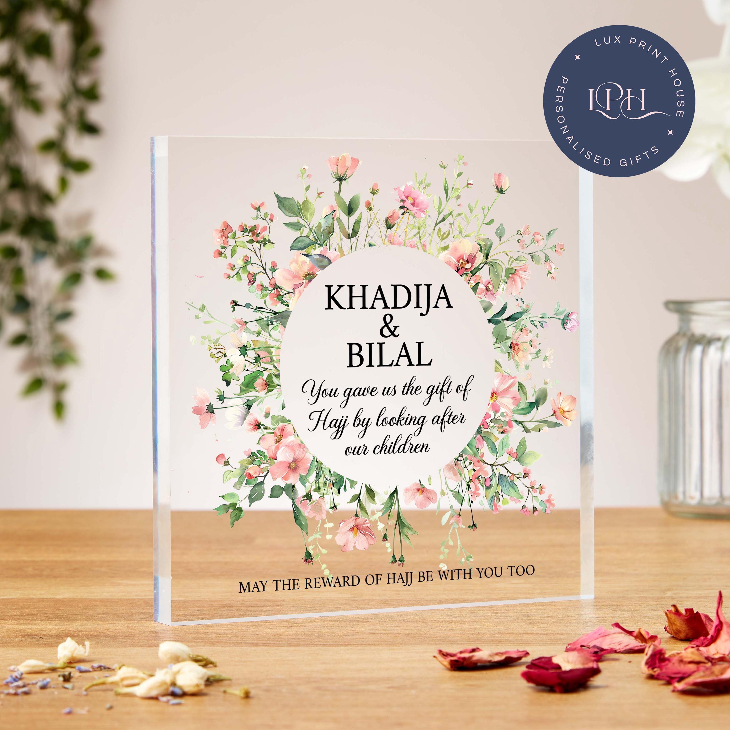 A delicate floral acrylic block gift designed to thank loved ones for supporting a Hajj journey. A circular floral wreath surrounds customisable text, perfect for adding names and a heartfelt message. Ideal for expressing gratitude to those who cared for children during Hajj. Includes the phrase: “May the reward of Hajj be with you too.” A thoughtful and elegant Islamic appreciation gift.